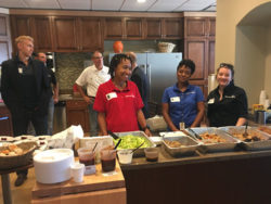 Platinum volunteers serving lunch