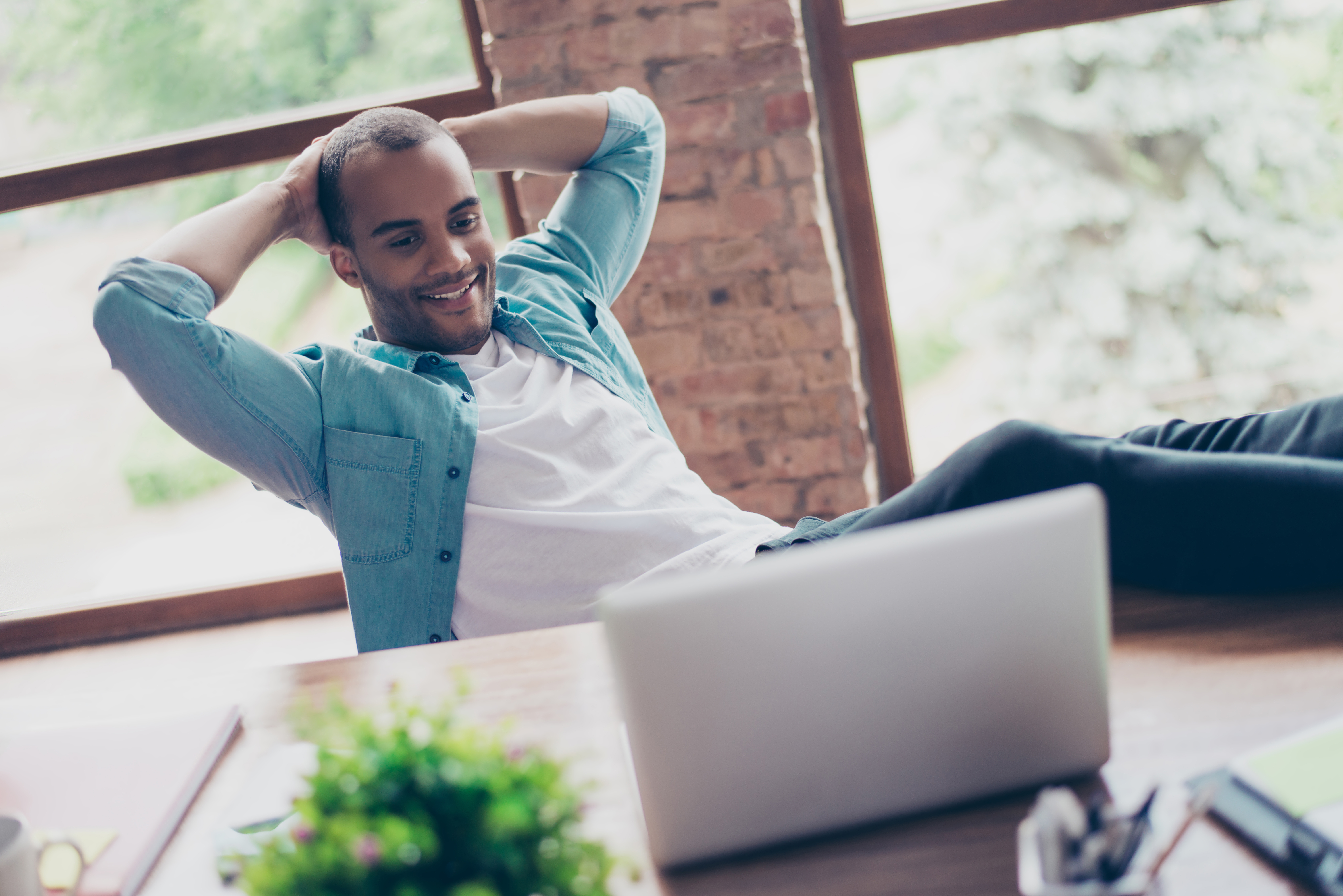 Relaxed man with laptop